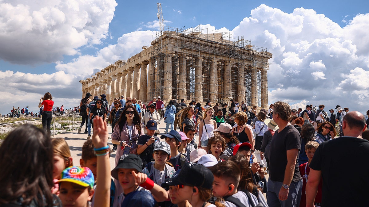Crowd of tourists in front of temple