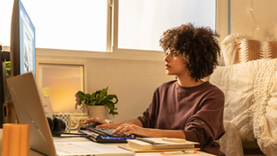 A woman on a computer using remote learning tools