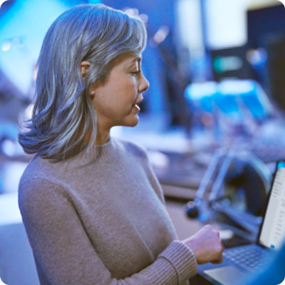 Person looking at a laptop.