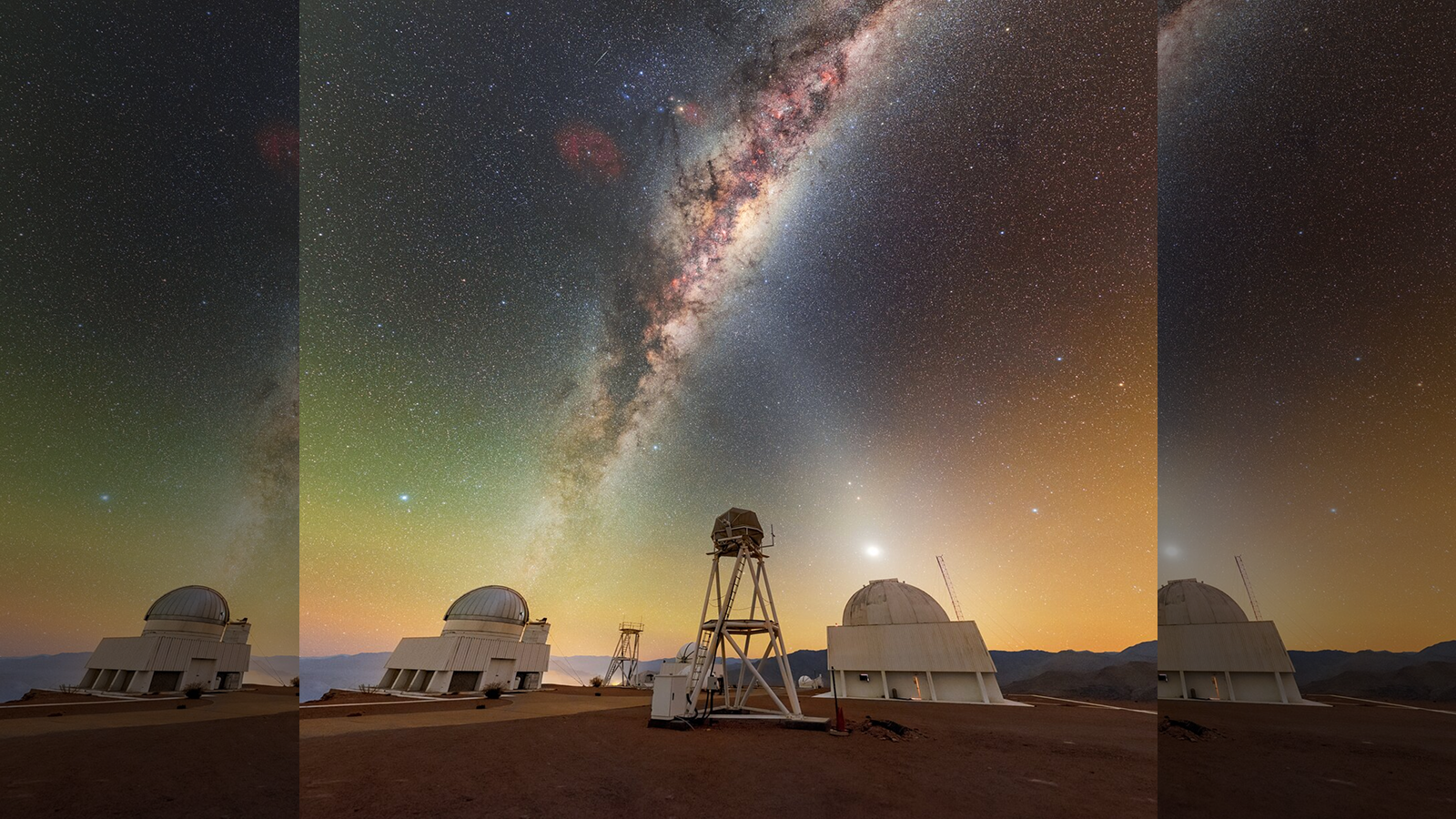 Photograph taken of the night sky showing the Milky Way and zodiacal light crisscross above the Cerro Tololo Inter-American Observatory in Chile.