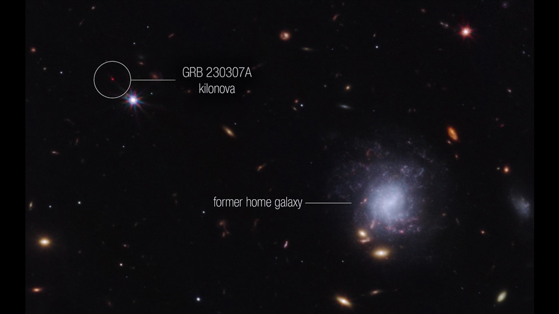 An image of outer space with a galaxy and GRB 230307A labeled 