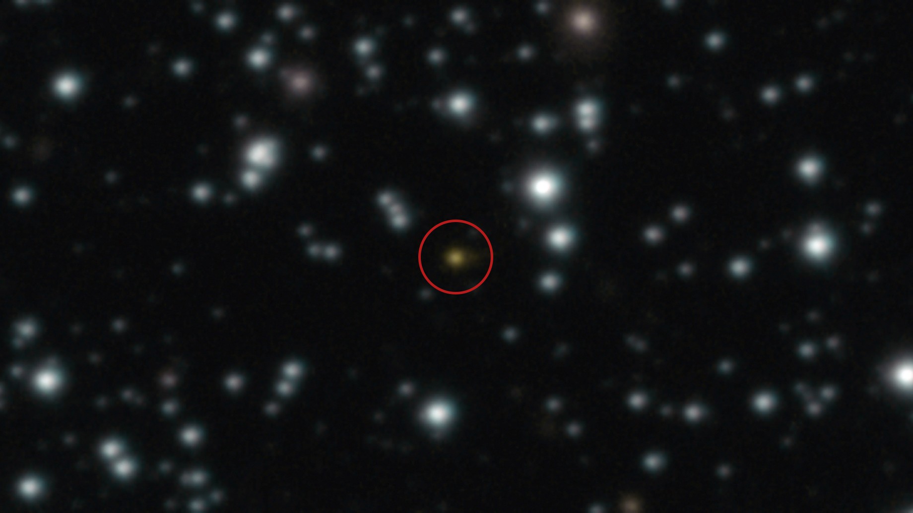 A photograph of the cosmic explosion, circled in red, taken with the Very Large Telescope&#039;s HAWK-I infrared camera.