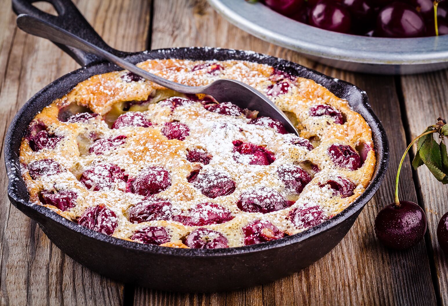 Cherry clafoutis in a baking dish.