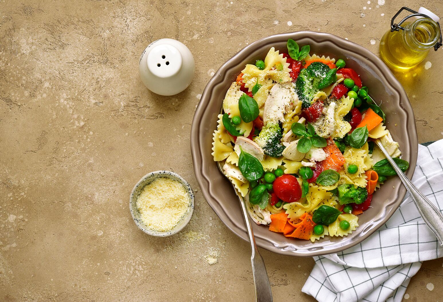 A bowl of farfalle pasta with vegetables.