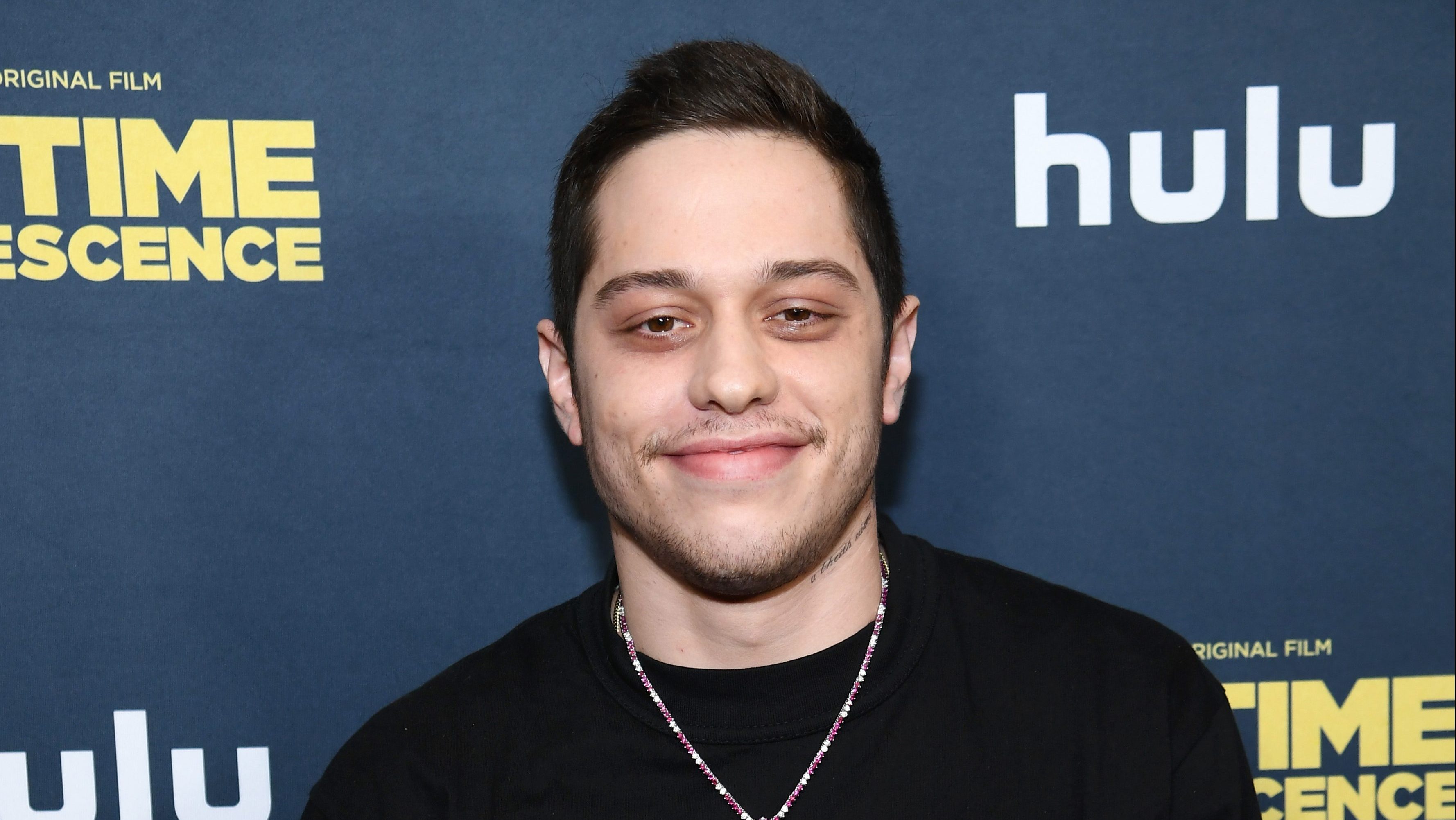 Pete Davidson poses on a red carpet.