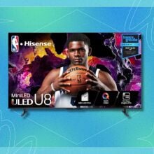 a Hisense TV displays a basketball player holding the ball with both hands at chest level while looking directly out of the TV