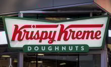 Sign at the entrance to the Krispy Kreme Doughnuts store 