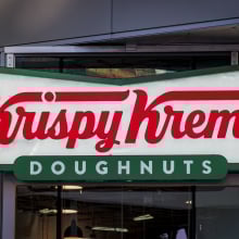 Sign at the entrance to the Krispy Kreme Doughnuts store 
