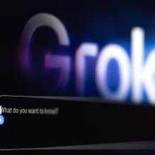 A zoomed in photo of the Grok AI homepage that reads "what do you want to know?"