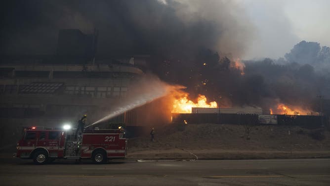 Torrance Firefighters are seen gearing up to fight the Palisades Fire, as residents try to escape the site in Pacific Palisades, California, Los Angeles, United States on January 8, 2025.