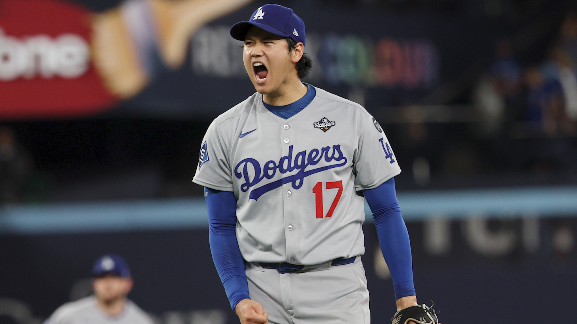 Los Angeles Dodgers two-way player Shohei Ohtani (17) reacts after striking out Toronto Blue Jays' Andrés Giménez to end the second inning of Game seven of the 121st World Series between the LA Dodgers and the Toronto Blue Jays at Rogers Centre.