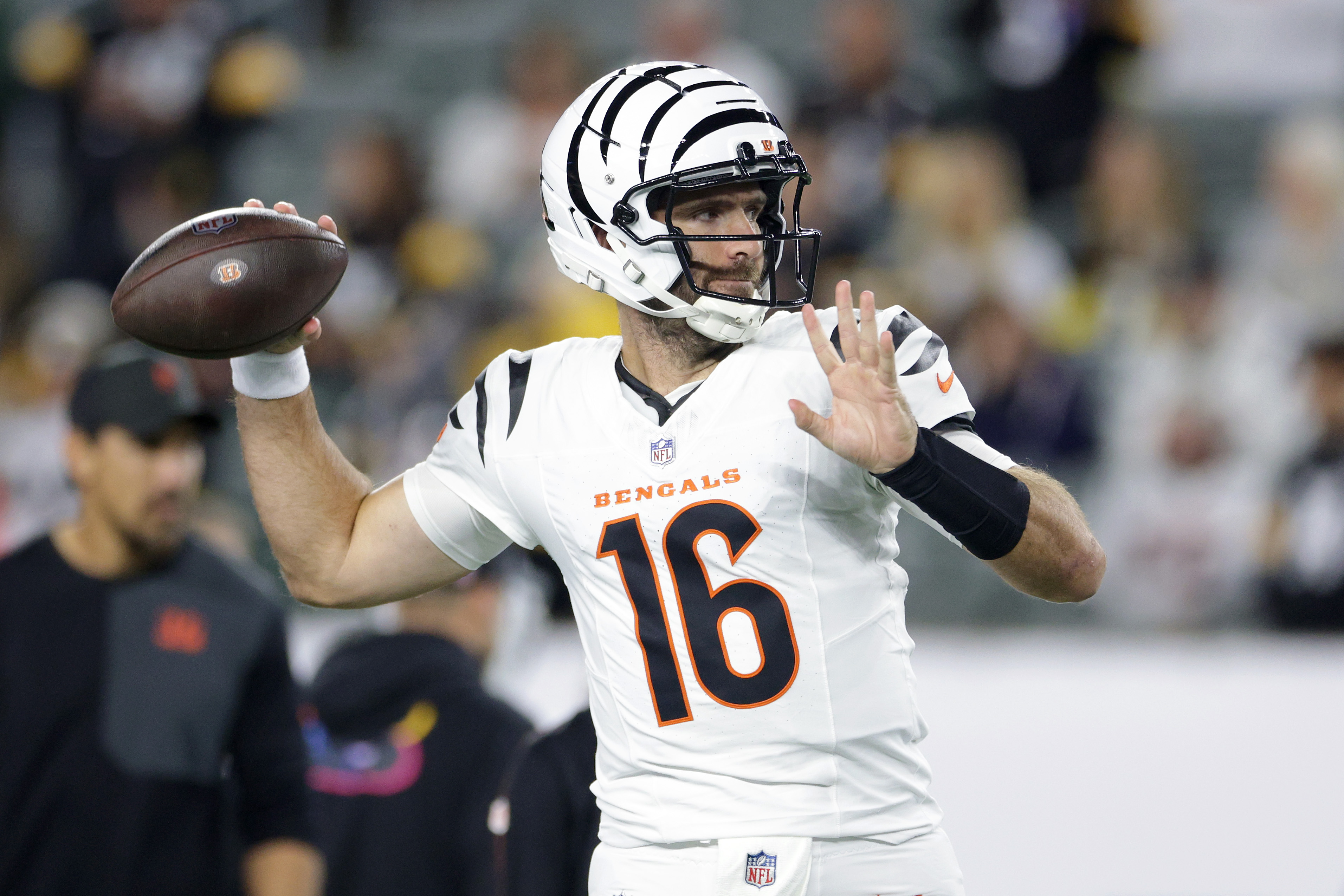Joe Flacco in a Bengals uniform with a football.