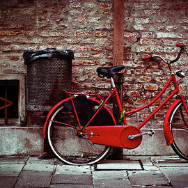 Vintage Bicycle Leaning Against Brick by Moreiso