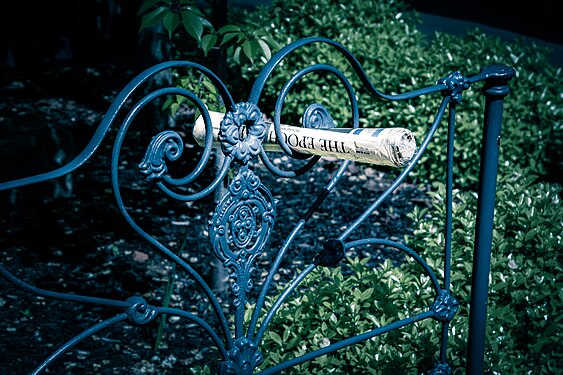 Rolled up newspaper delivered to a home in Redan, Victoria.