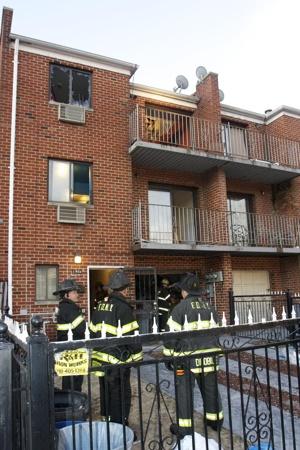 Firefighters at the scene of the deadly blaze.