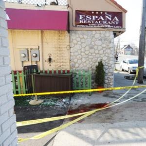 FATEFUL SPOT: The wall of the Espana Restaurant where partiers were urinating, setting off the fight that killed Anthony Lacertosa, is marked off with police tape yesterday.