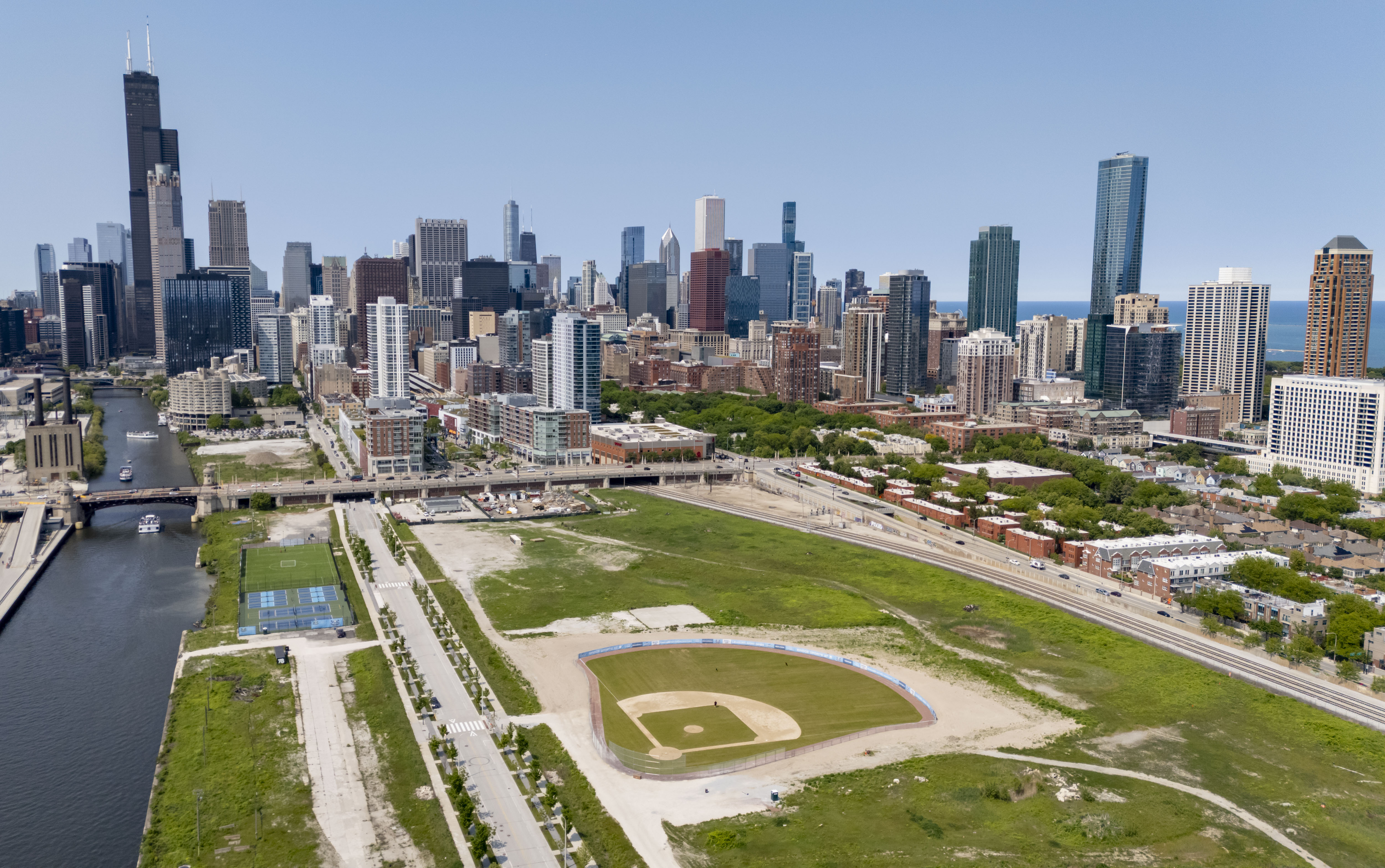 New pickleball courts and baseball and soccer fields are visible along South Wells Street in The 78, a largely vacant 62-acre former rail yard site in the South Loop, on June 1, 2025. (Brian Cassella/Chicago Tribune)