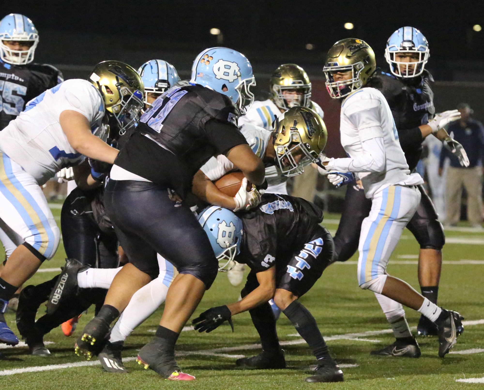 Quartz Hills’ Ashtin Dupleasis tries to get through Comptons Samson Tupuola and Erick Barrios in the CIFSS Division 12 championship in Compton, CA, on Saturday, November 27, 2021. (Photo by Tracey Roman, Contributing Photographer)
