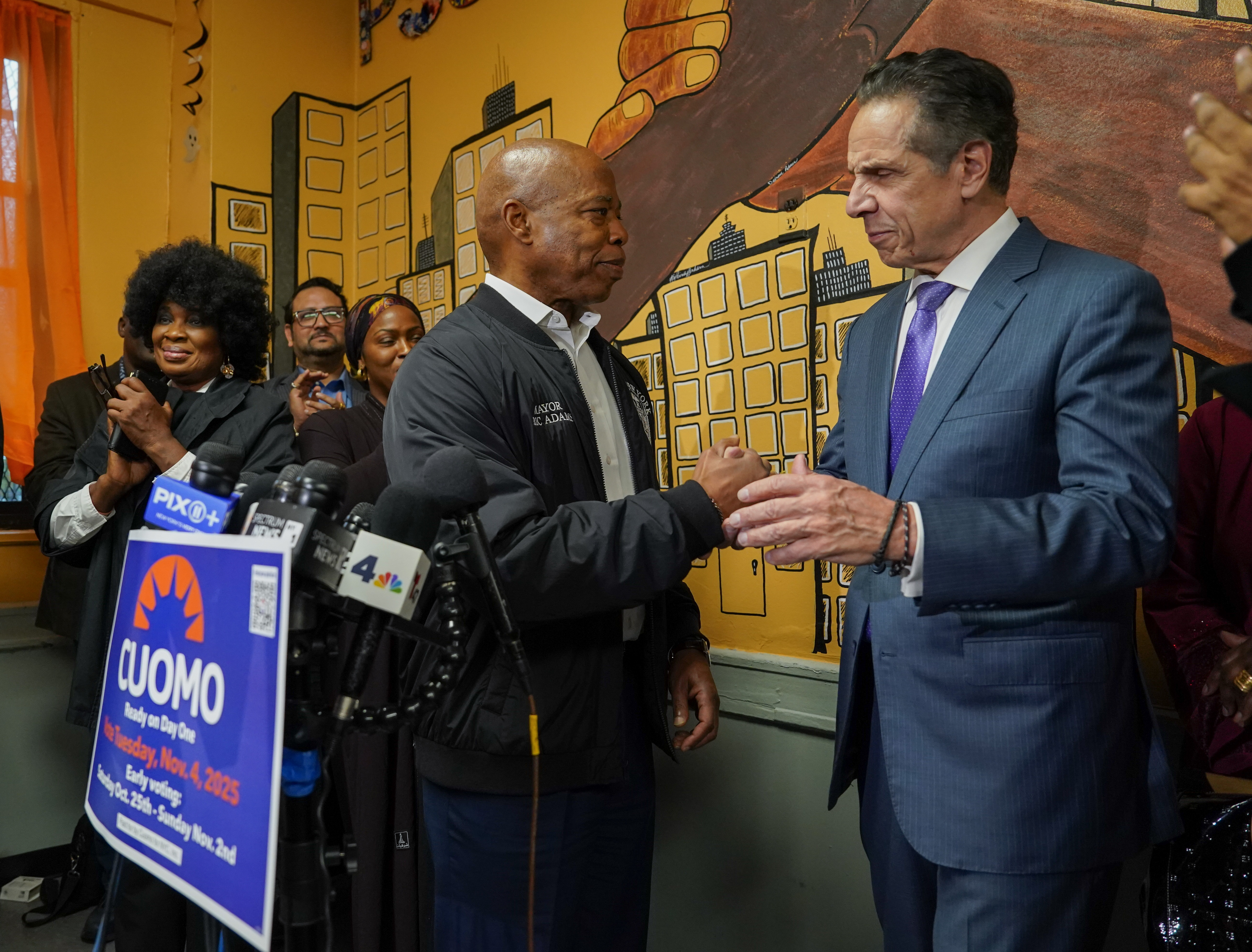 Mayor Eric Adams shakes Andrew Cuomo’s hand at a press conference where Muslim leaders gave their support to Andrew Cuomo at the Martin Luther King Jr. Senior Center in Harlem Thursday, Oct. 30, 2025 in Manhattan, New York. (Barry Williams/ New York Daily News)