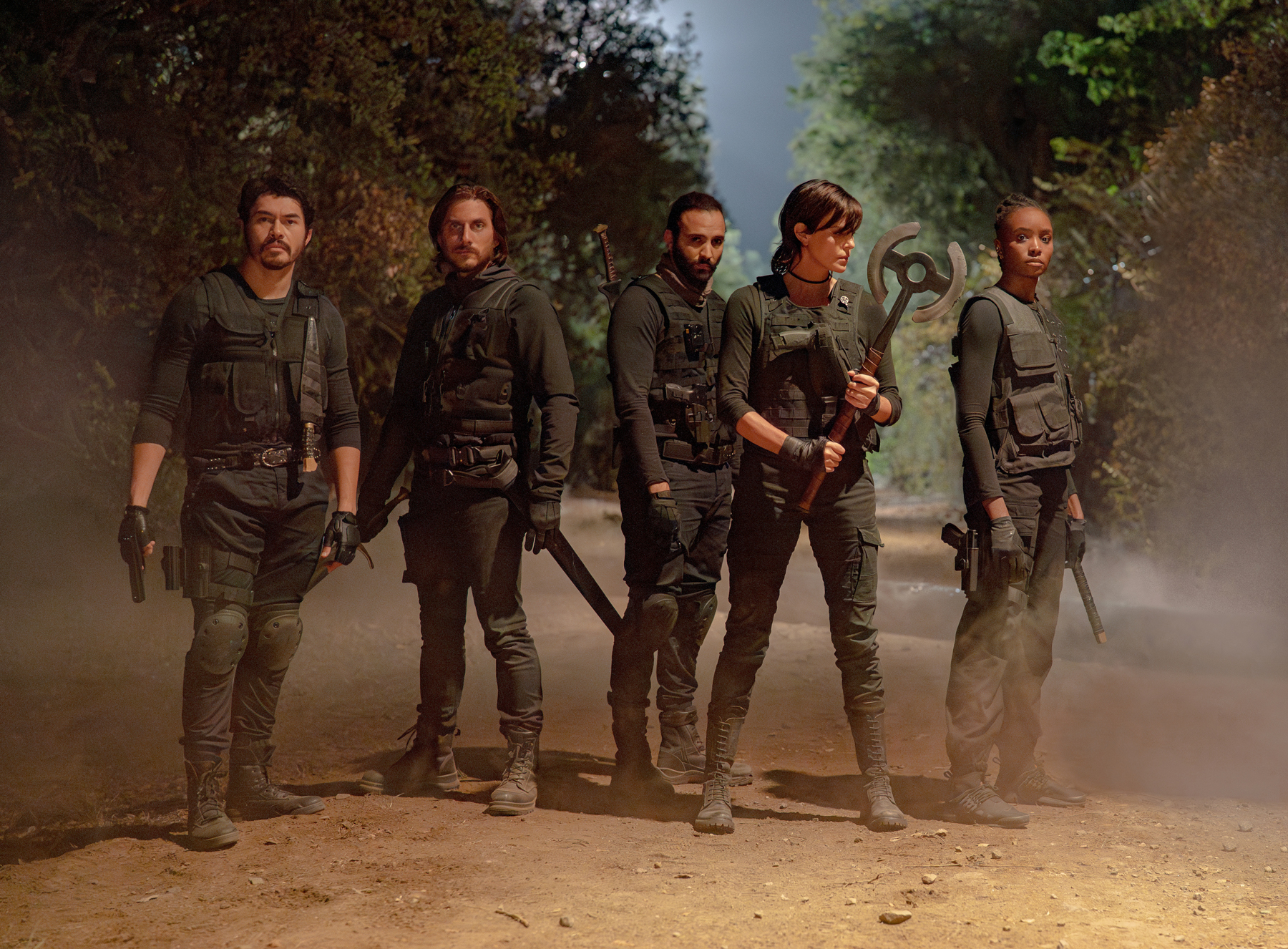 The Old Guard 2 (L-R) Henry Golding as Tuah, Luca Marinelli as Nicky, Marwan Kenzari as Joe, Charlize Theron as Andy and KiKi Layne as Nile in The Old Guard 2. Cr. Eli Joshua Ade/Netflix © 2025