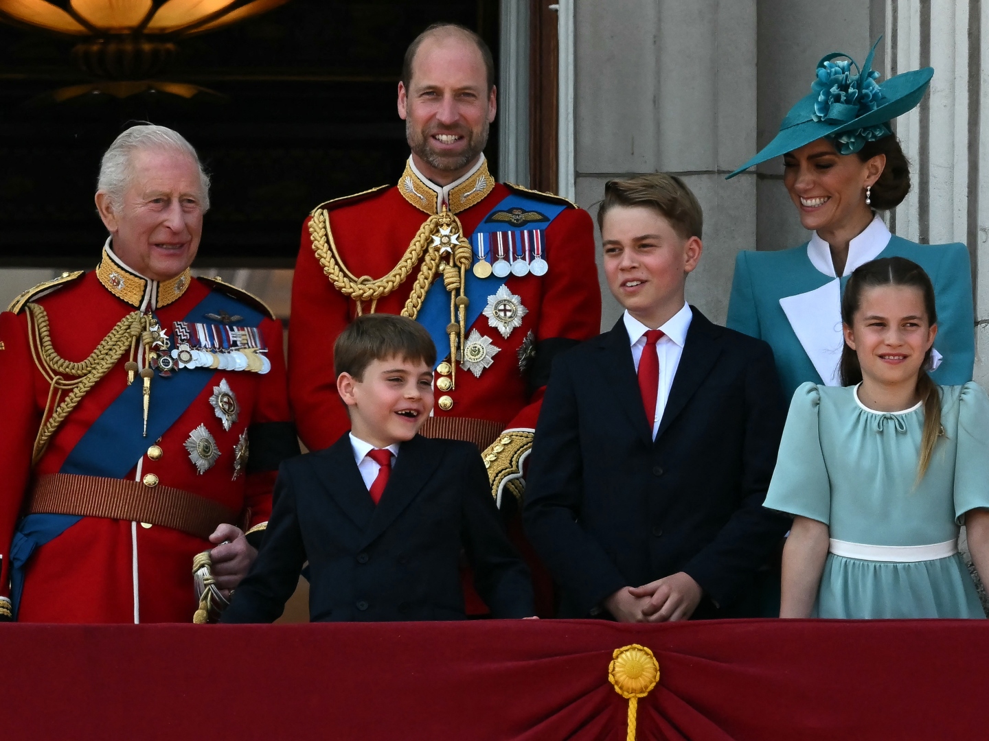 TOPSHOT - (L to R) Britain's King Charles III, Britain's Prince William, Prince of Wales, Britain's Prince Louis of Wales, Britain's Prince George of Wales, Britain's Catherine, Princess of Wales and Britain's Princess Charlotte of Wales, smile whilst standing on the balcony of Buckingham Palace after attending the King's Birthday Parade "Trooping the Colour" in London on June 14, 2025. The ceremony of Trooping the Colour is believed to have first been performed during the reign of King Charles II. Since 1748, the Trooping of the Colour has marked the official birthday of the British Sovereign. Over 1500 parading soldiers and almost 300 horses take part in the event. ()